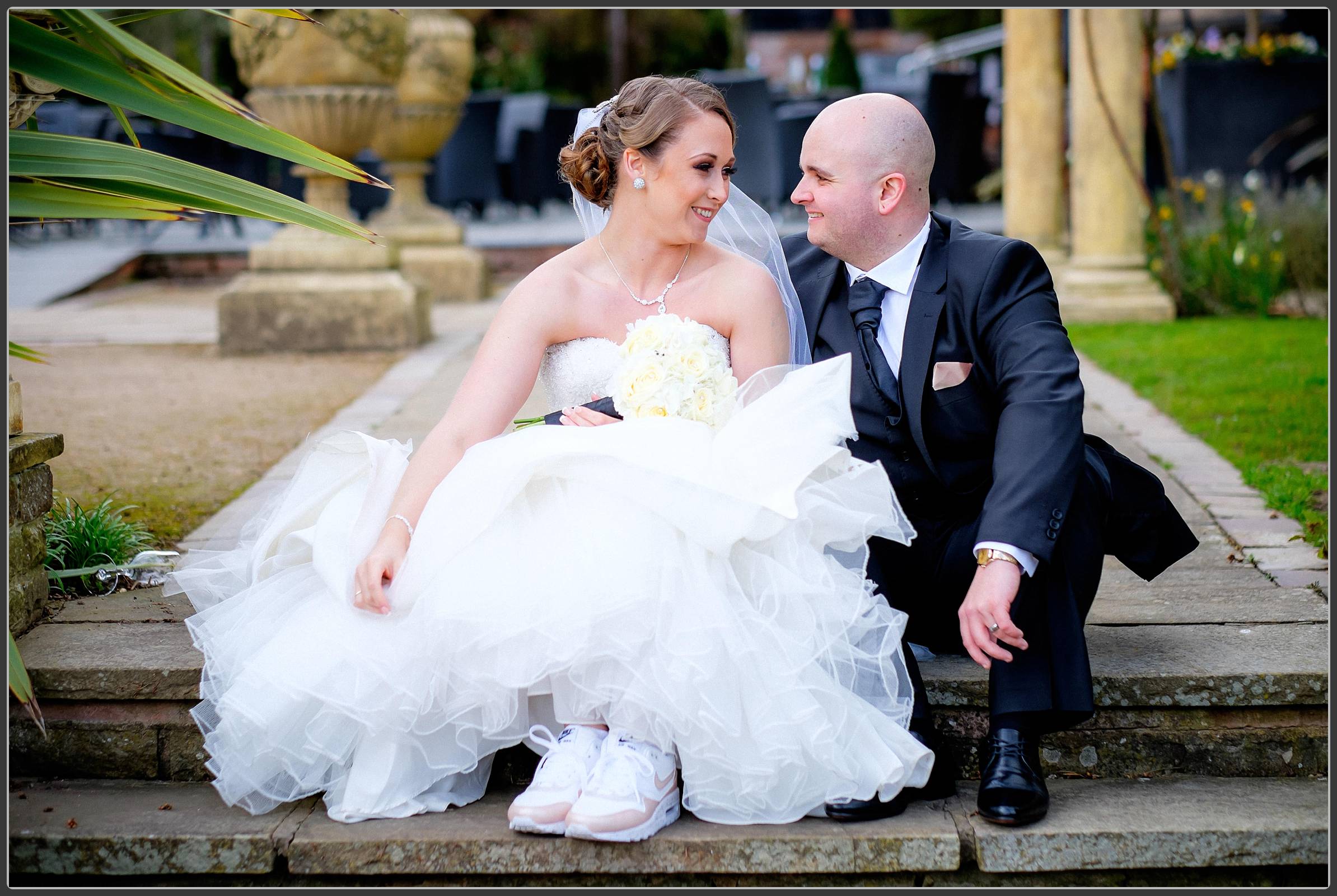 Bride and groom sitting on the steps