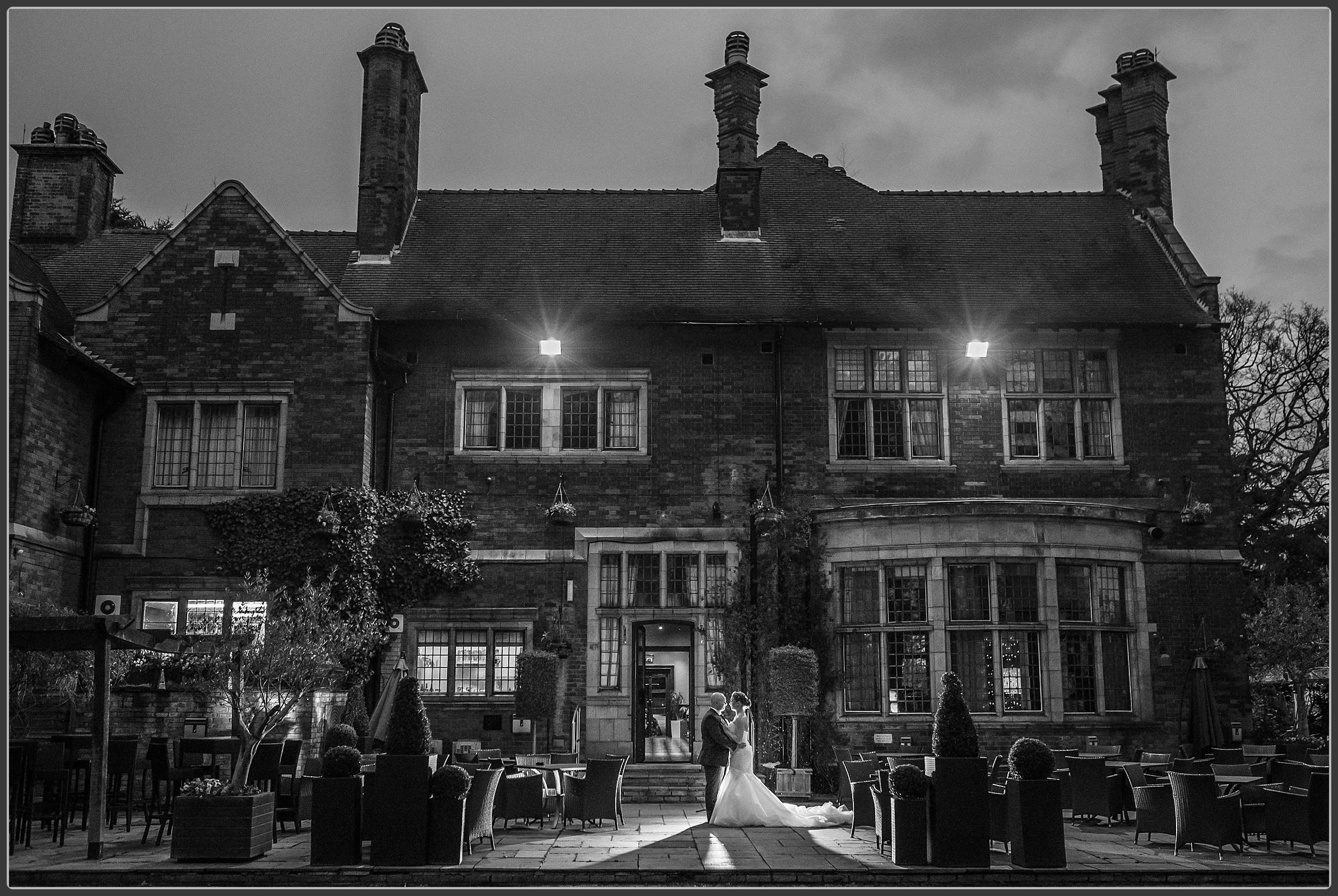 The bride and groom outside at Moxhull Hall Hotel