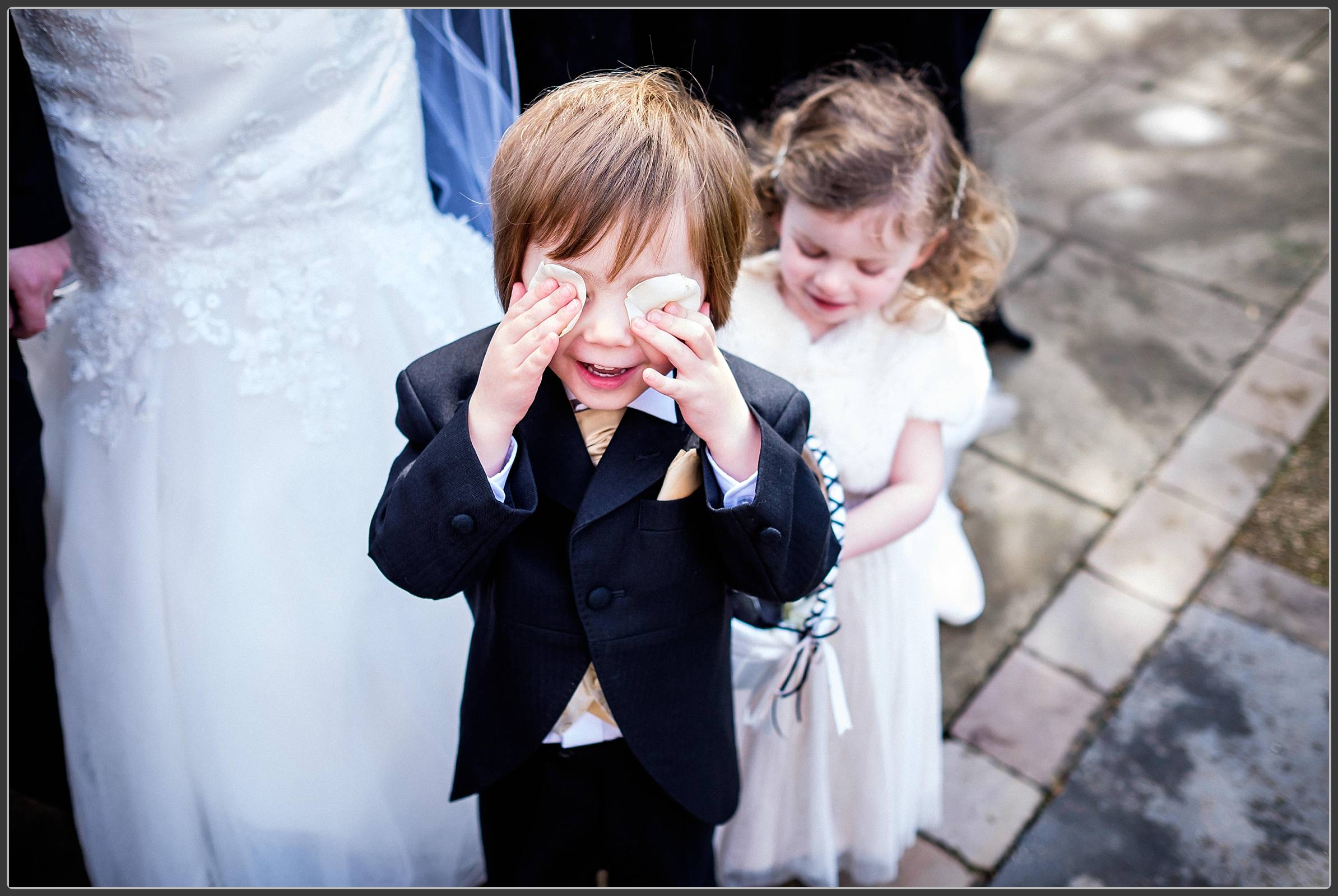 Children playing with wedding petals