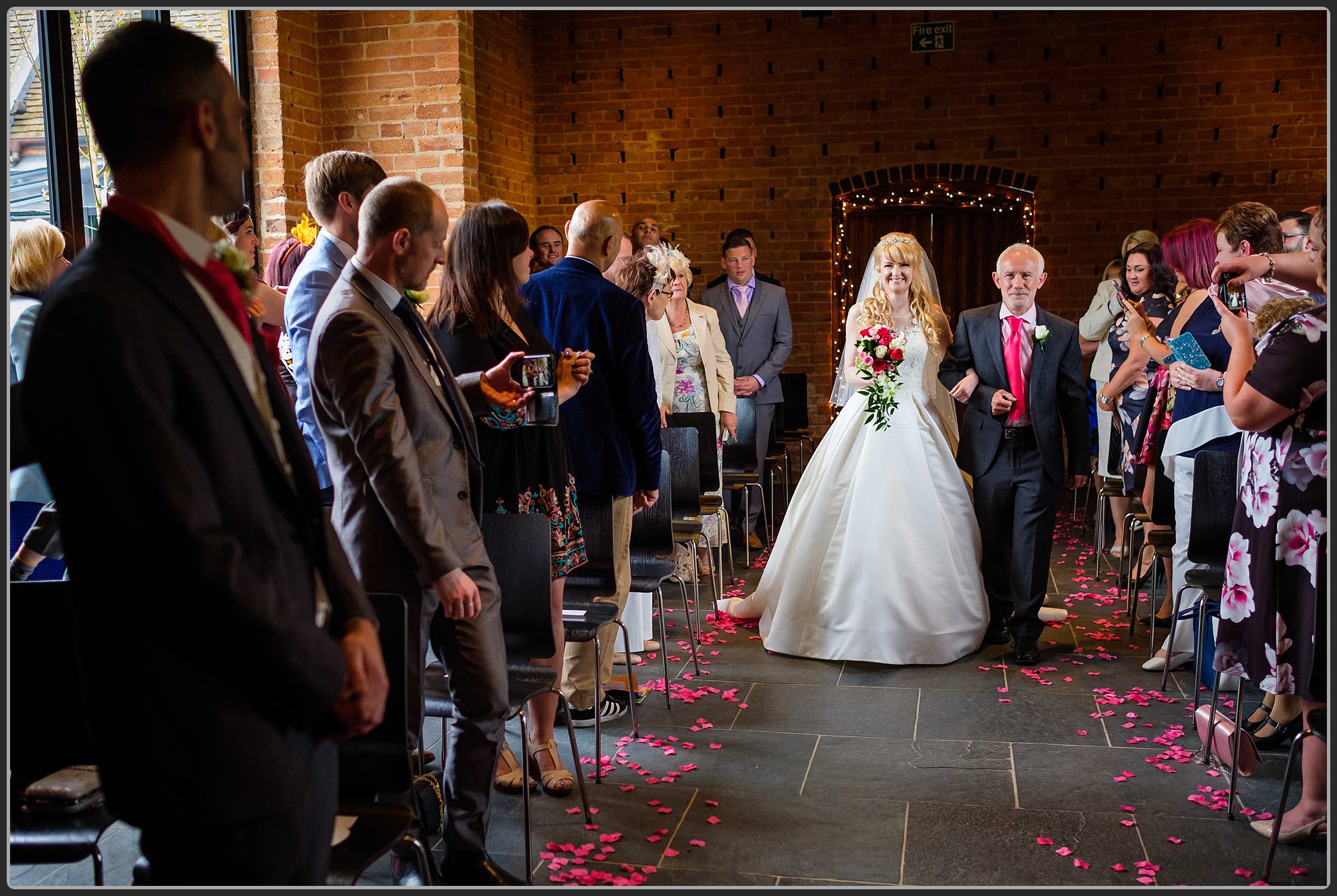 Bride and father walking down the aisle