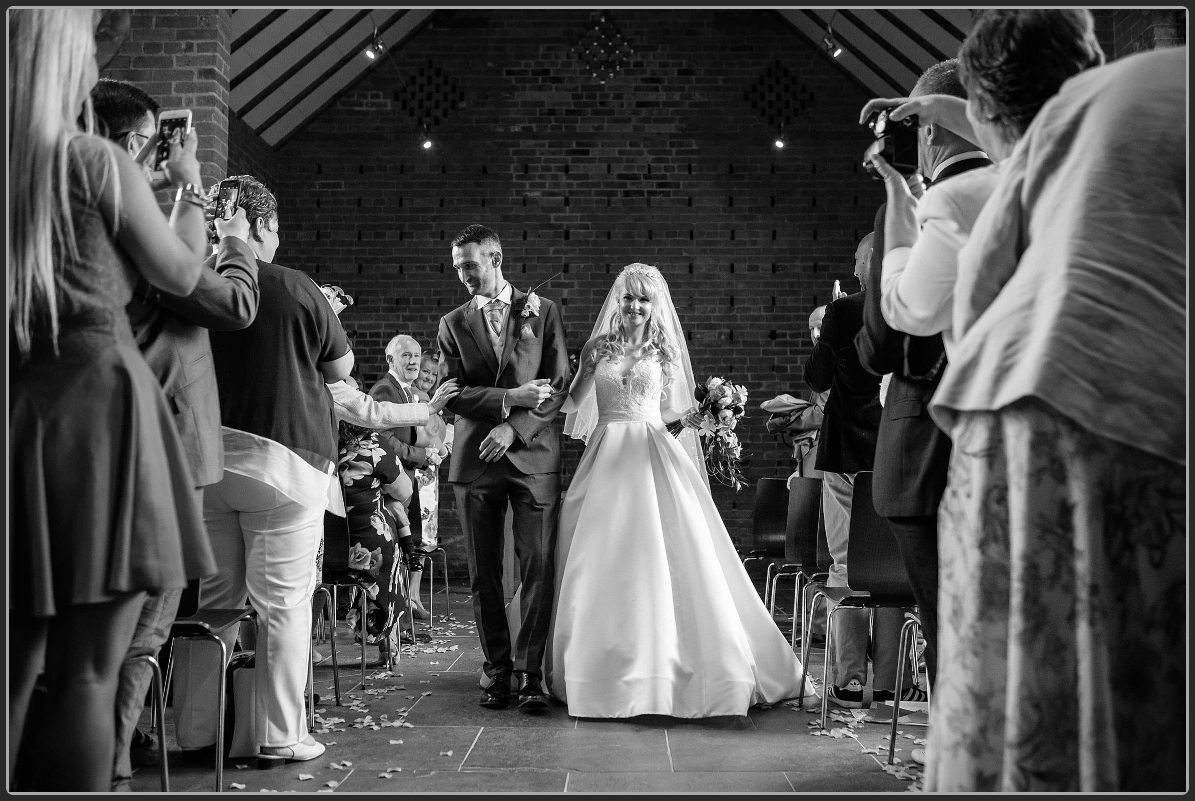 Bride and groom leaving the ceremony