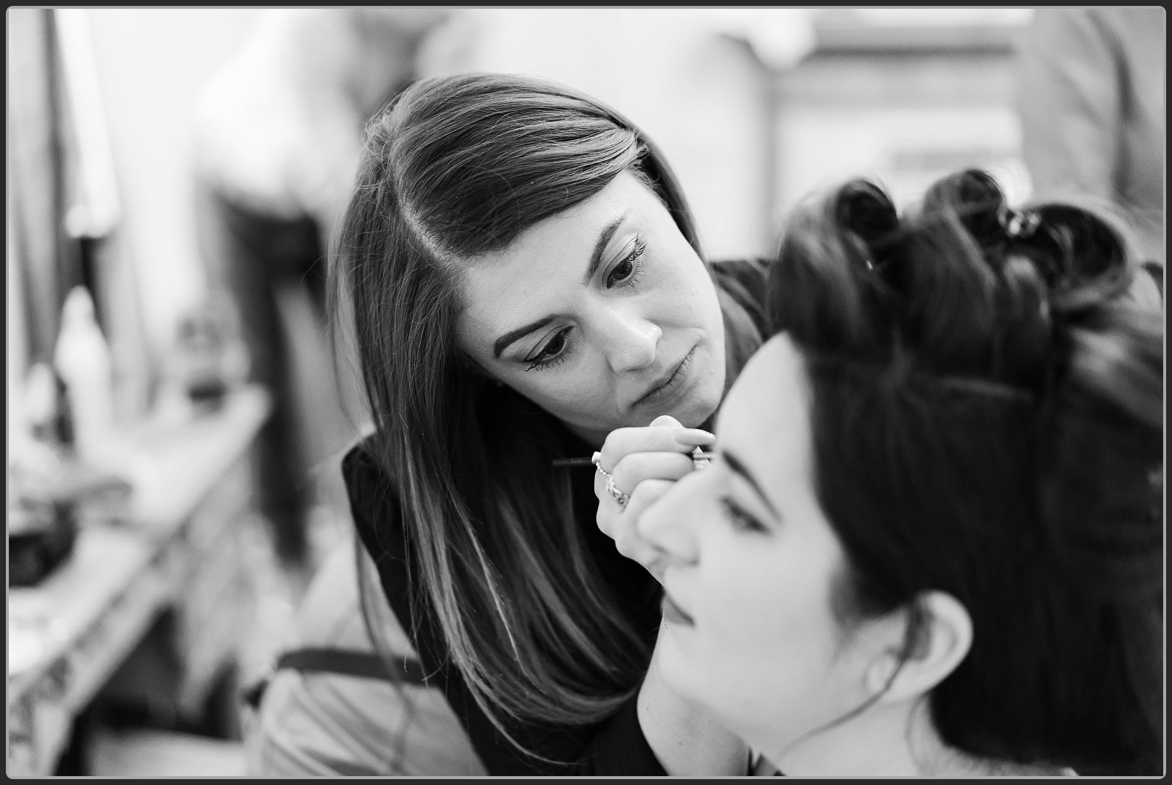 The bride having her makeup done