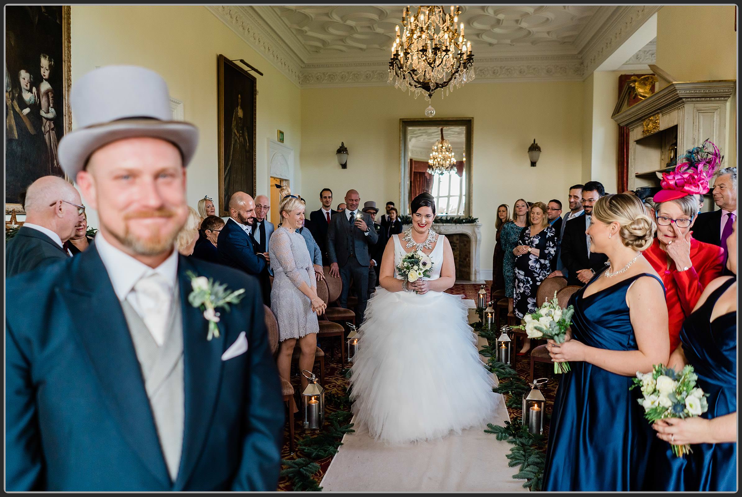 Cat as she walks down the aisle at Fawsley Hall Hotel