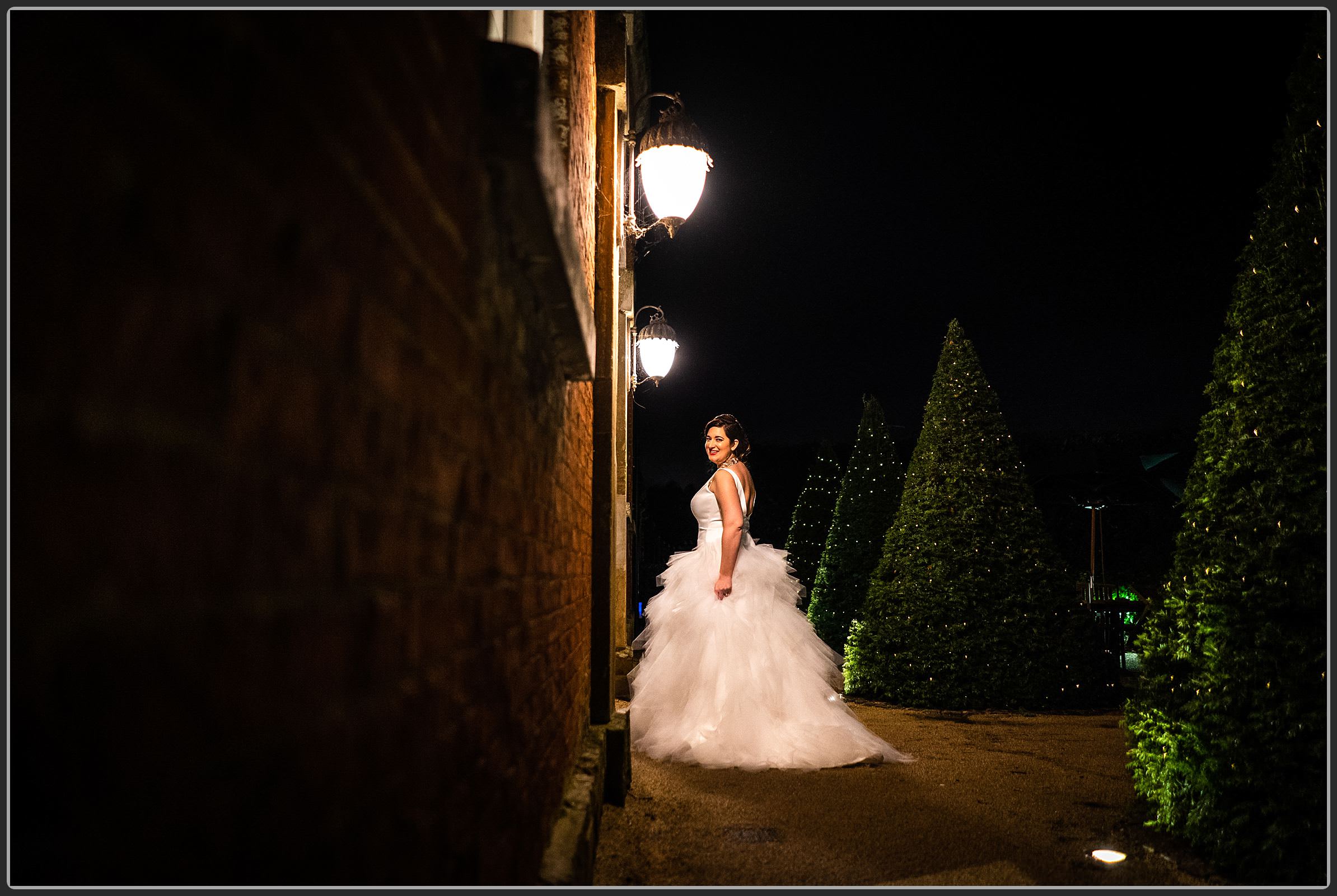 The bride outside at Fawsley Hall Hotel