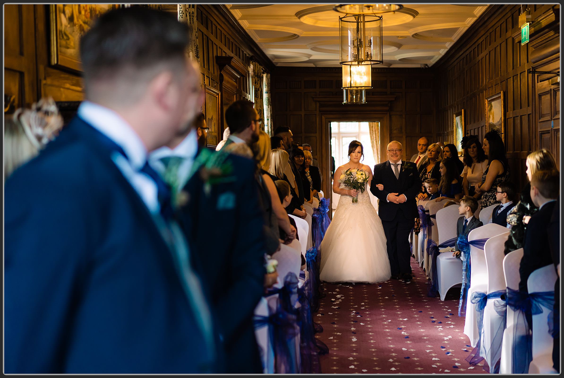 Bride and her father walking down the aisle