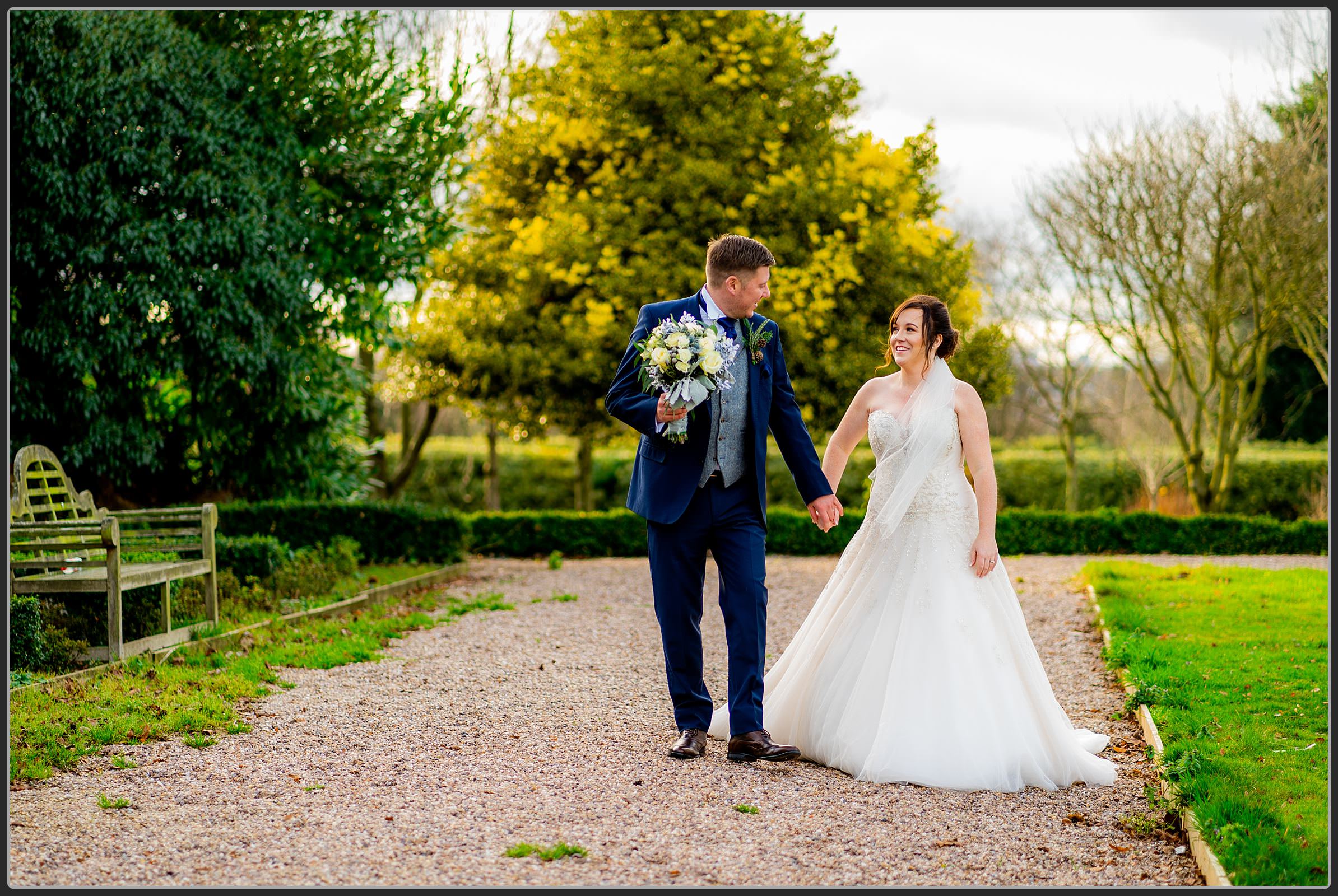 Bride and groom walking at the Castle Bromwich Hall Hotel
