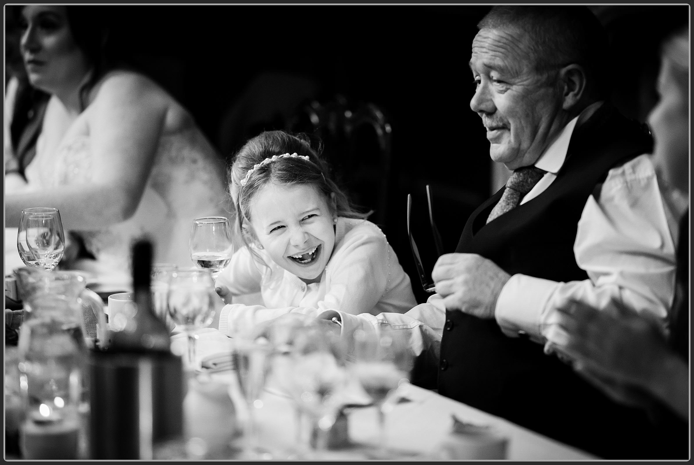Flower girl laughing during the speeches