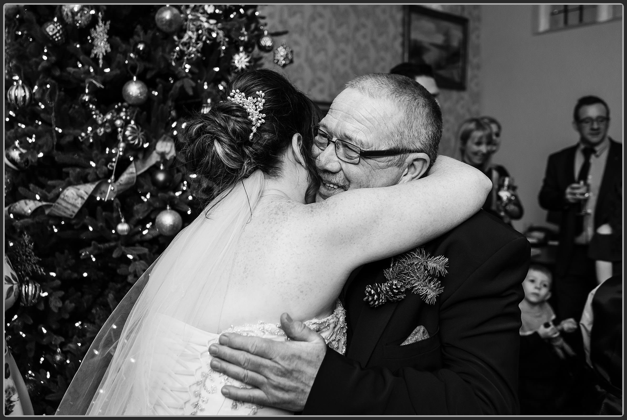 Bride and father embrace