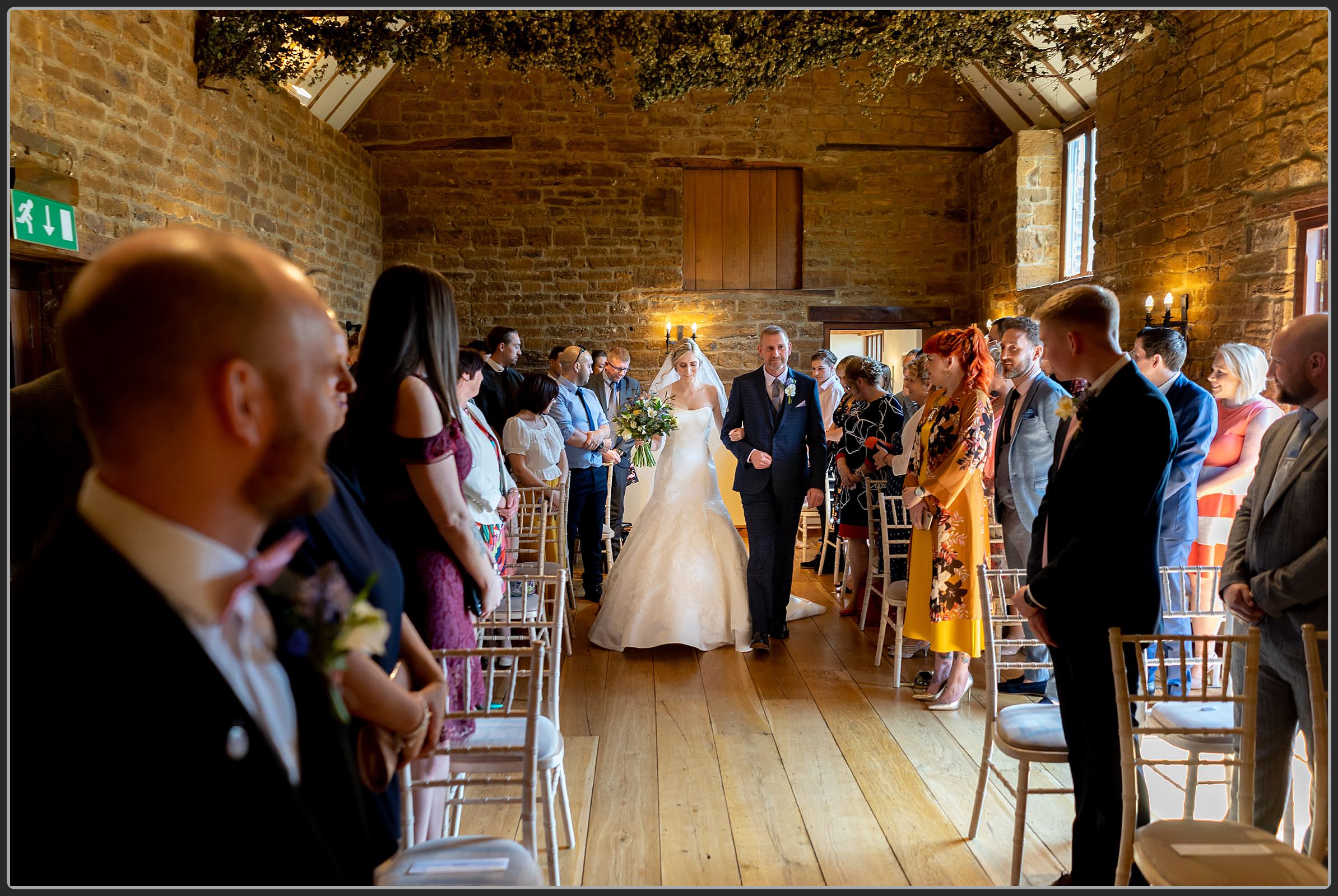 The bride and her father walking down the aisle