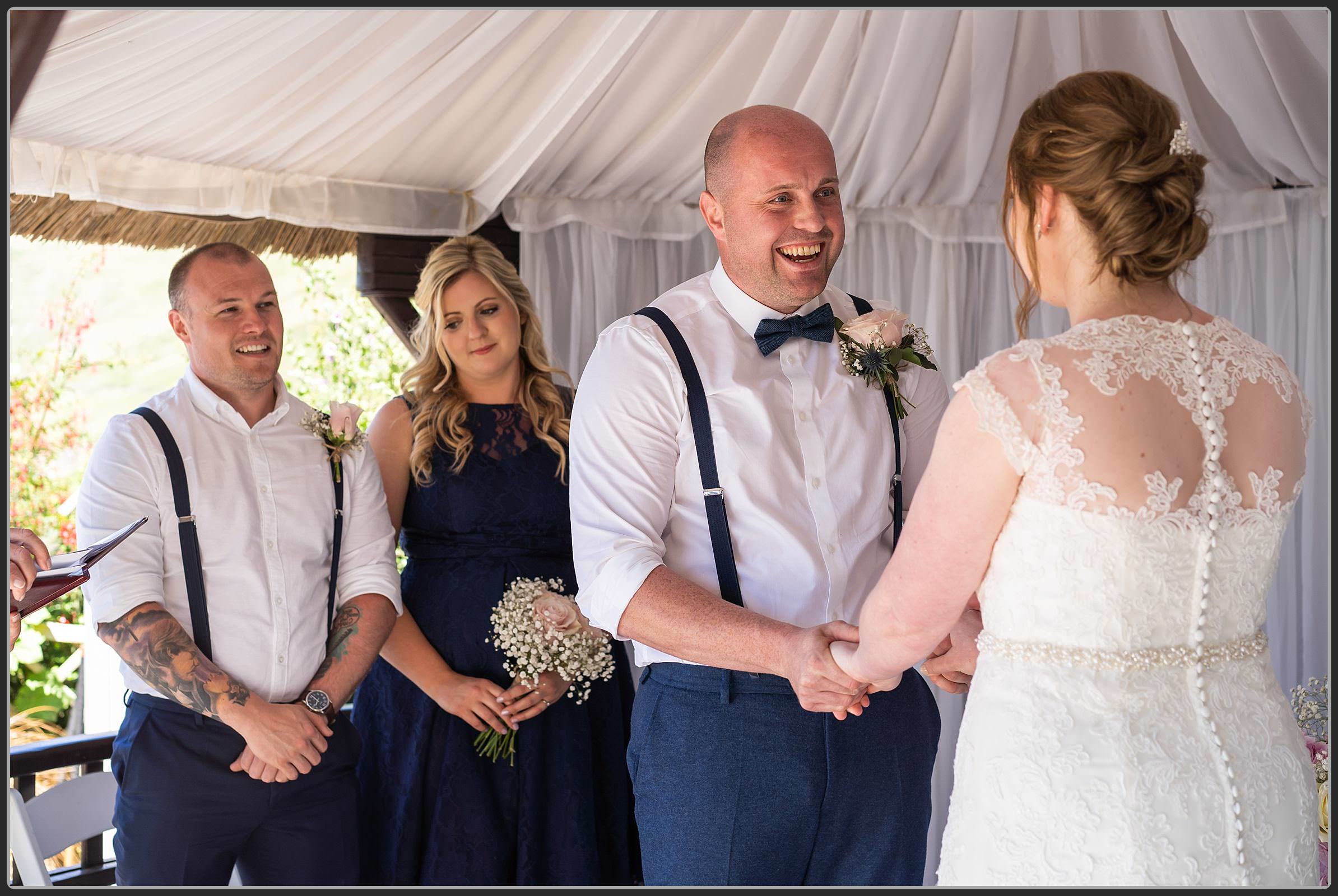 The couple laughing during the ceremony