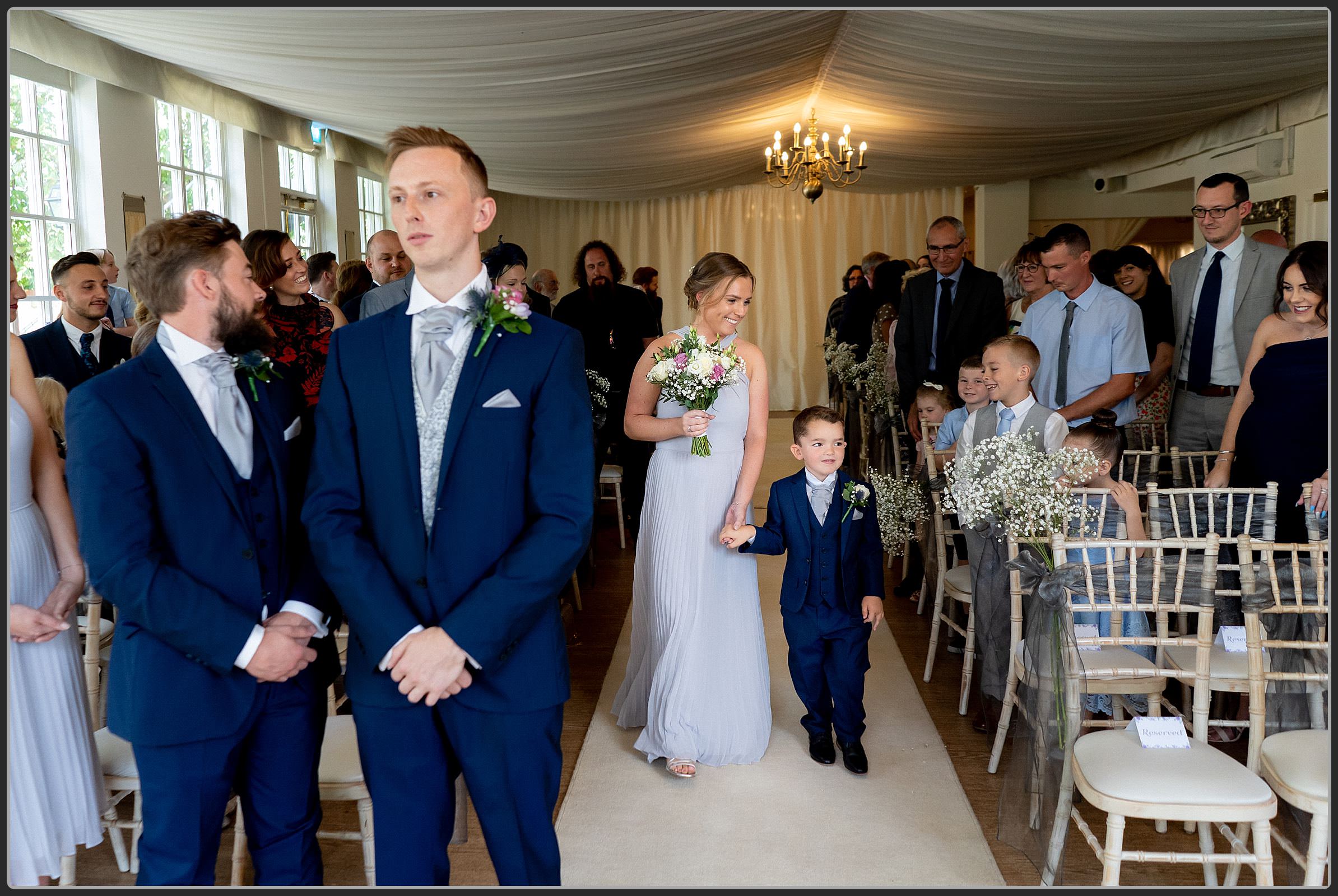 The bridal party walking down the aisle