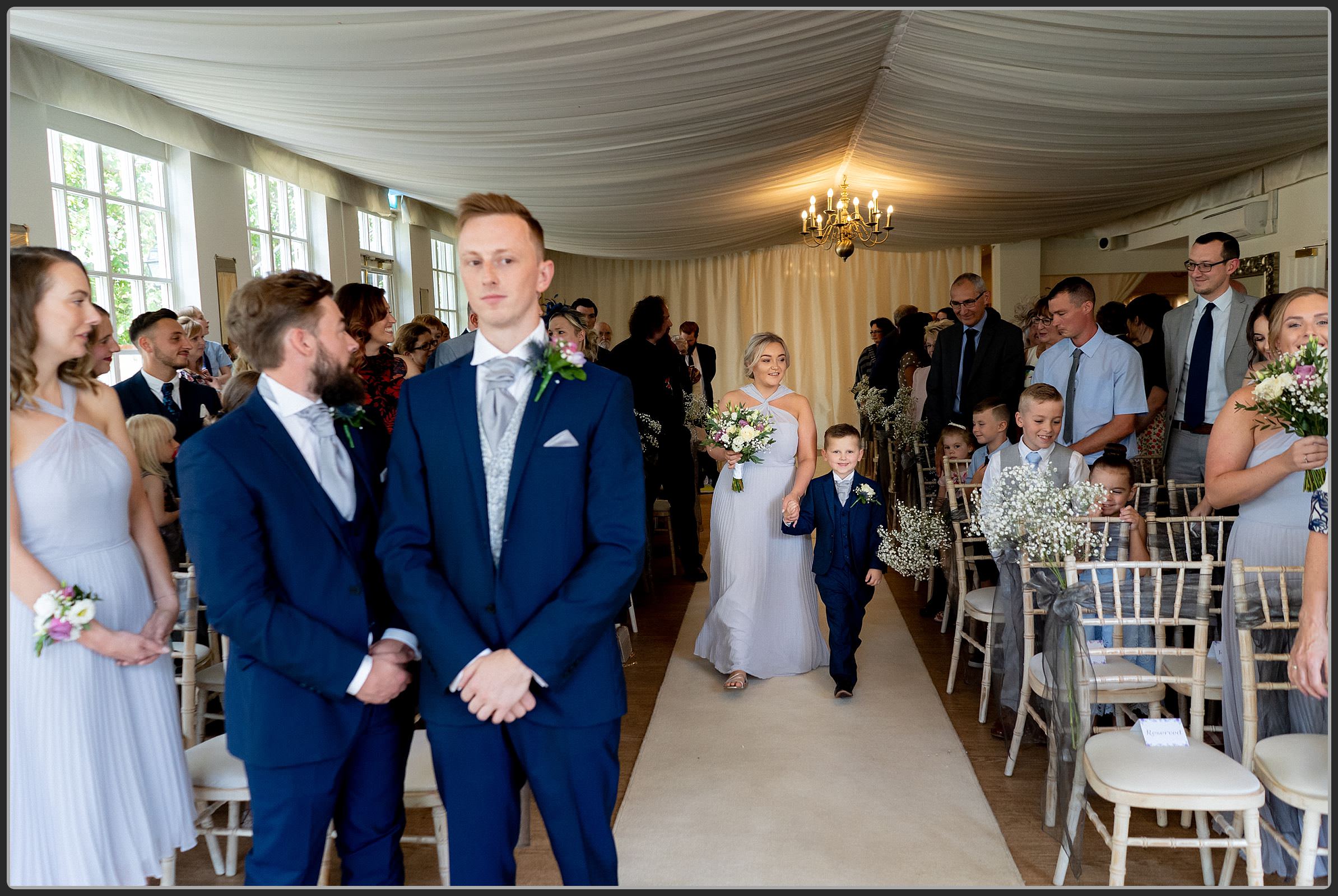 The bridal party walking down the aisle