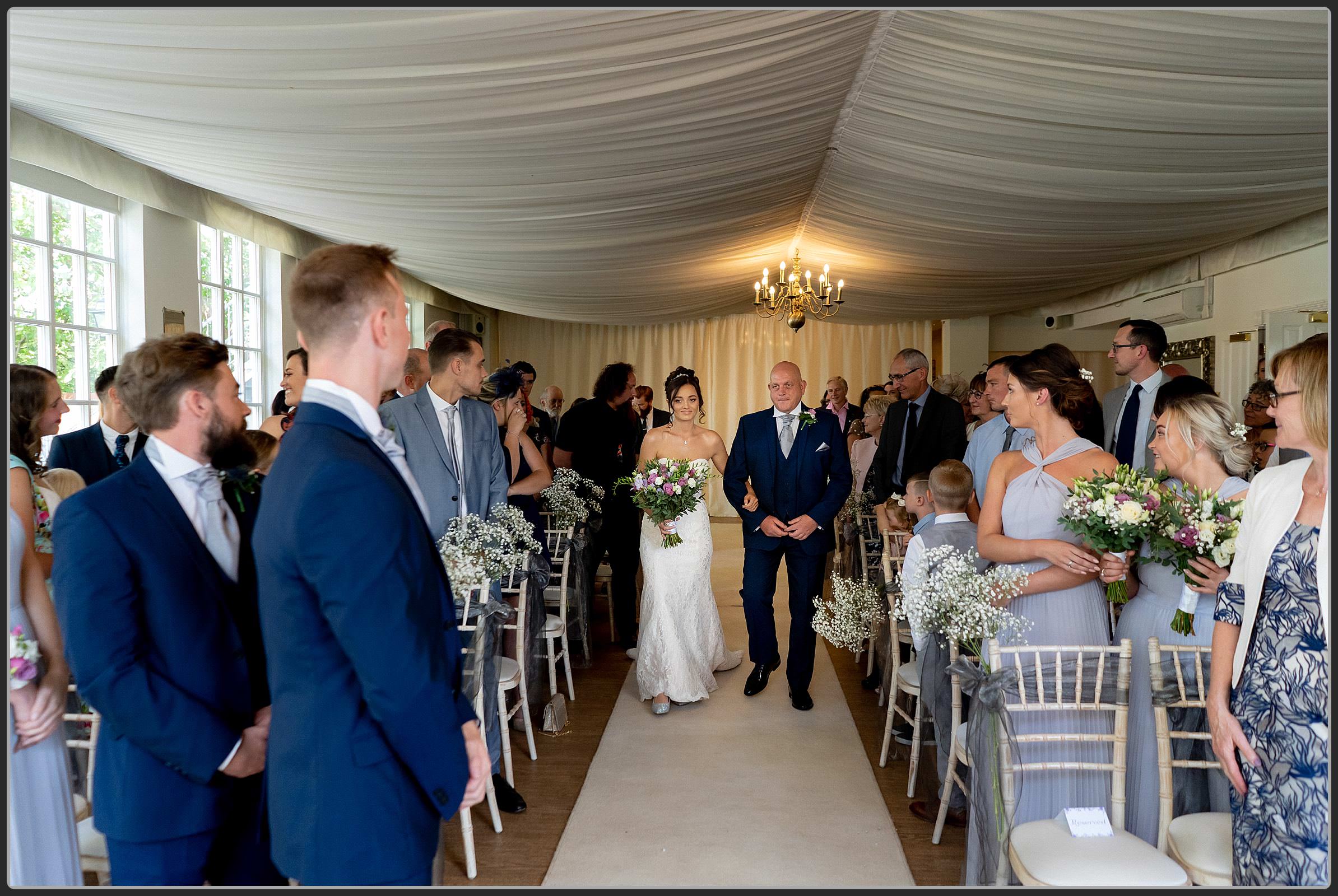 The bridal party walking down the aisle