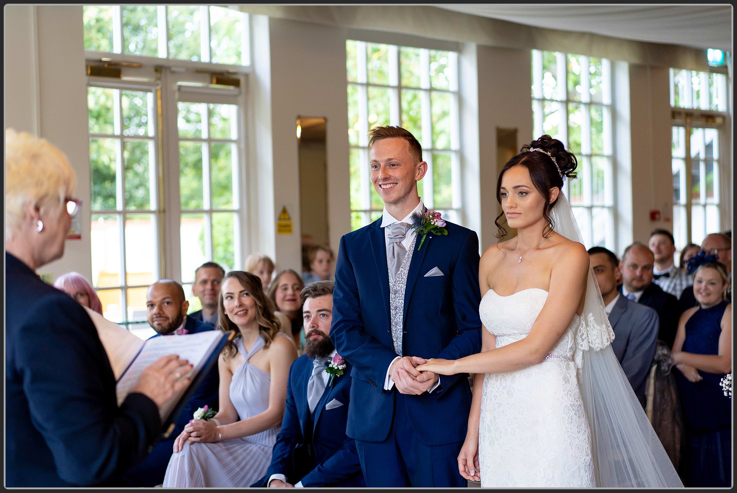 The Bride and Groom during the ceremony at Warwick House