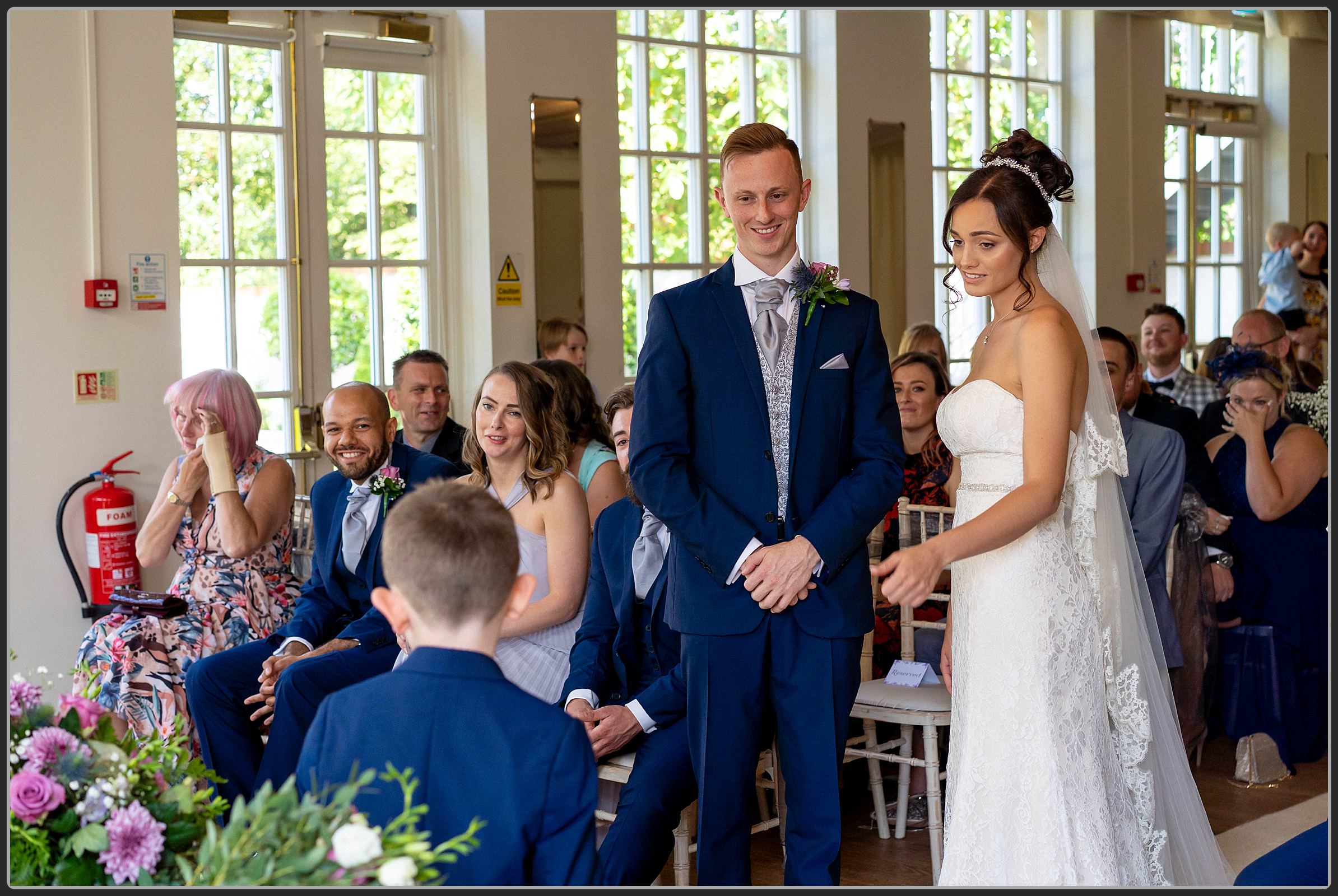 The Bride and Groom during the ceremony at Warwick House