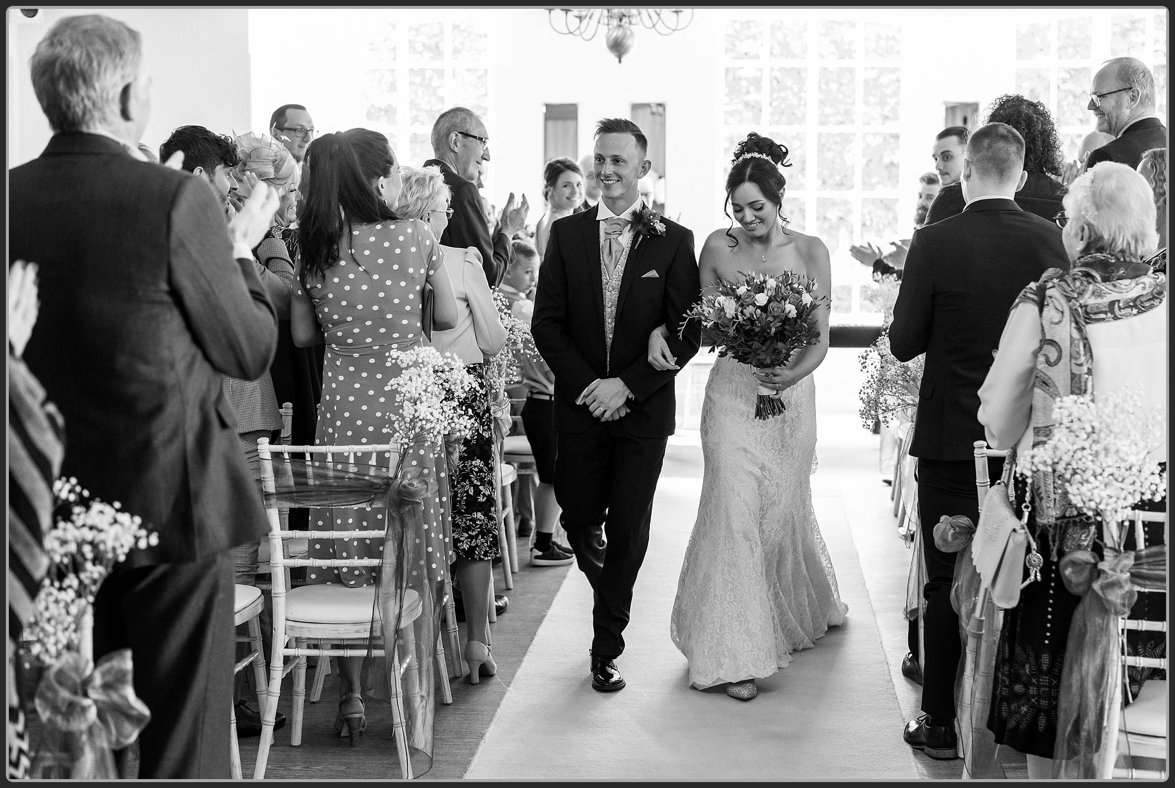 The Bride and Groom walking down the aisle