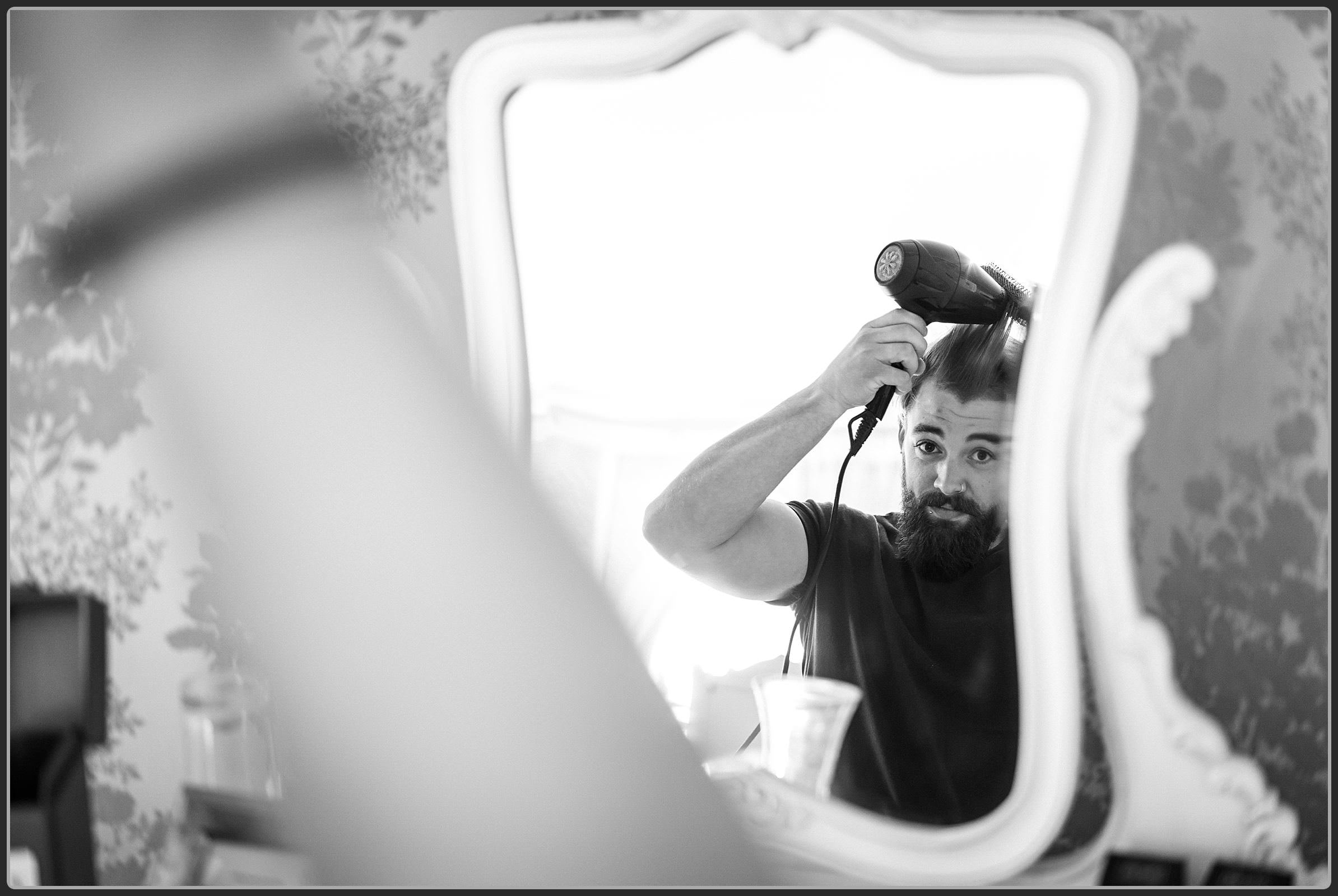 Groomsmen doing his hair