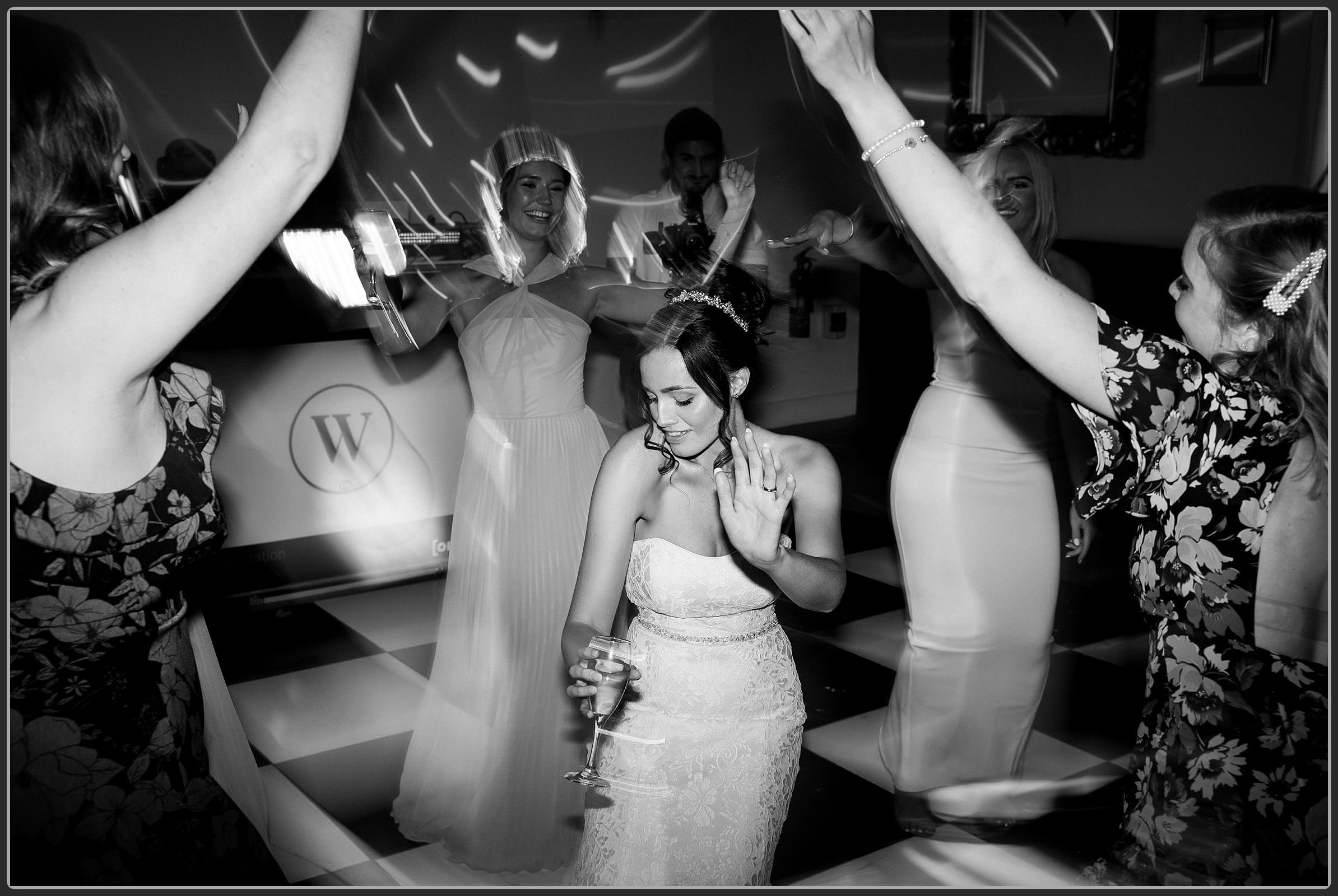 The wedding guests dancing