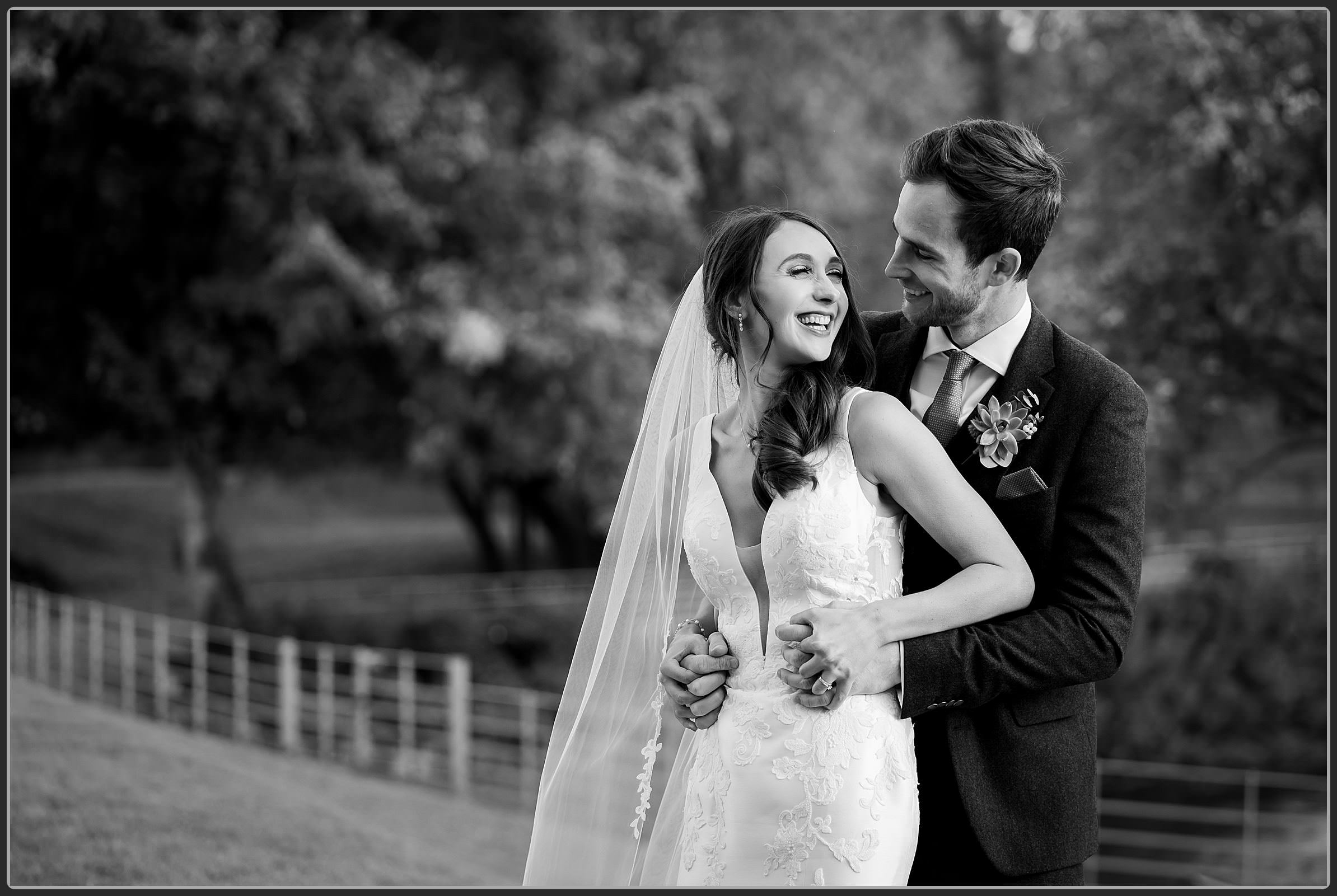 The bride and groom together in black and white