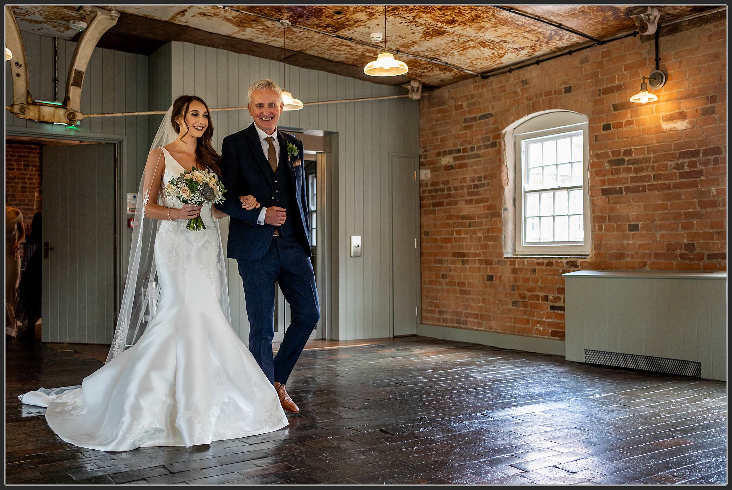 Father and daughter walking down the aisle