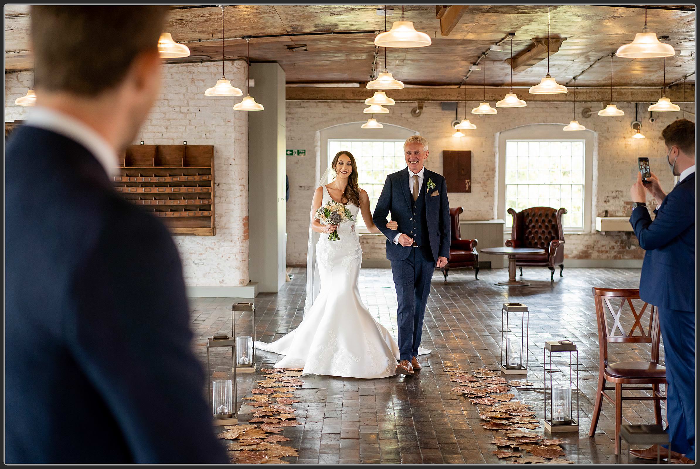 Father and daughter walking down the aisle