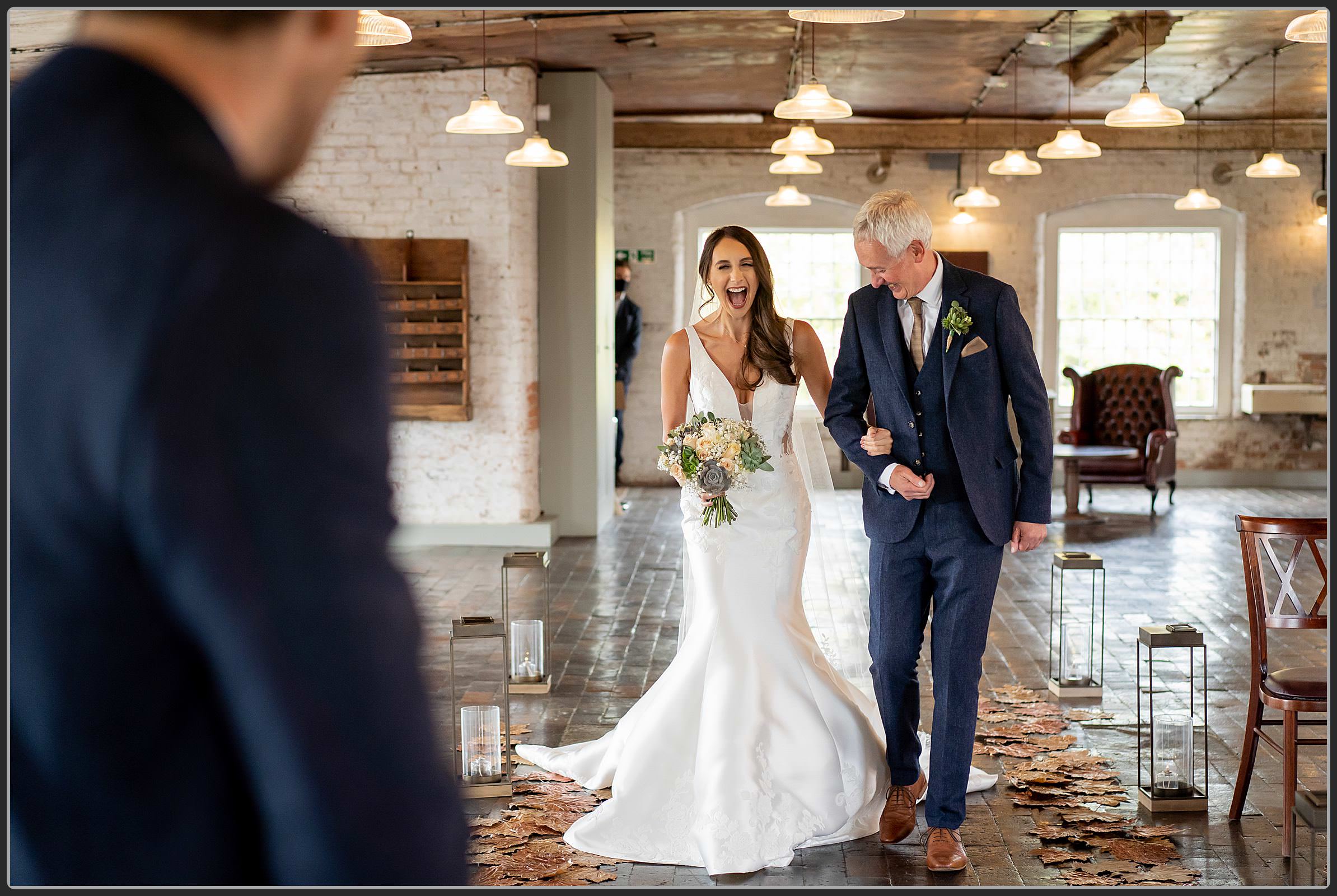 Father and daughter walking down the aisle