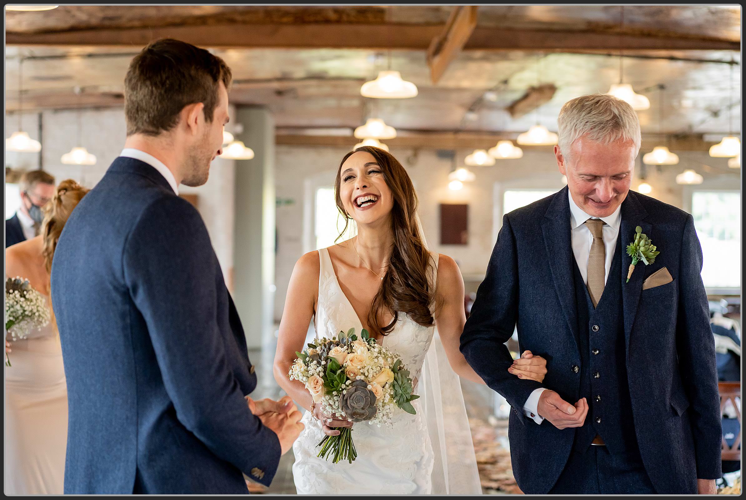 Father and daughter walking down the aisle