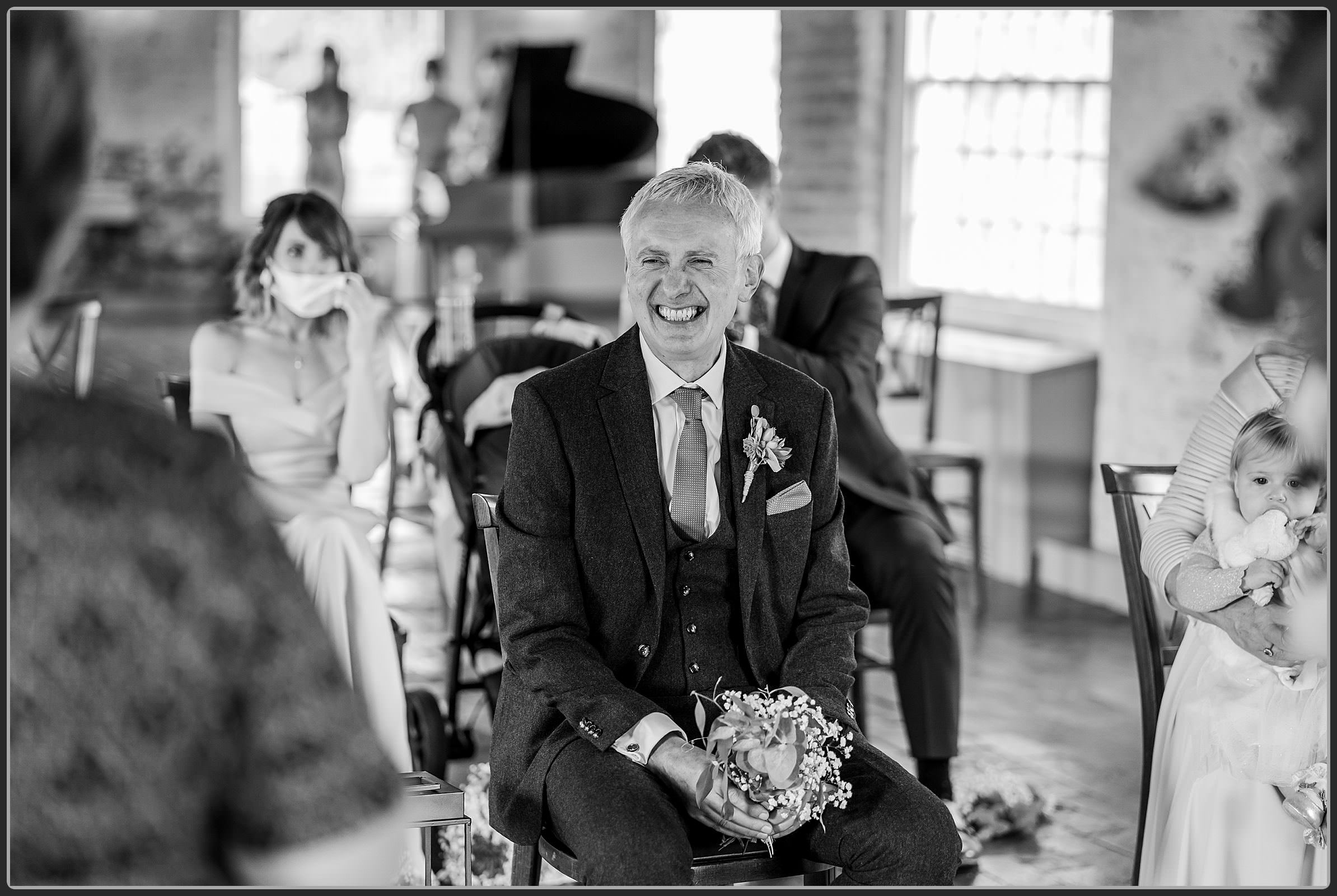 Father of the bride laughing