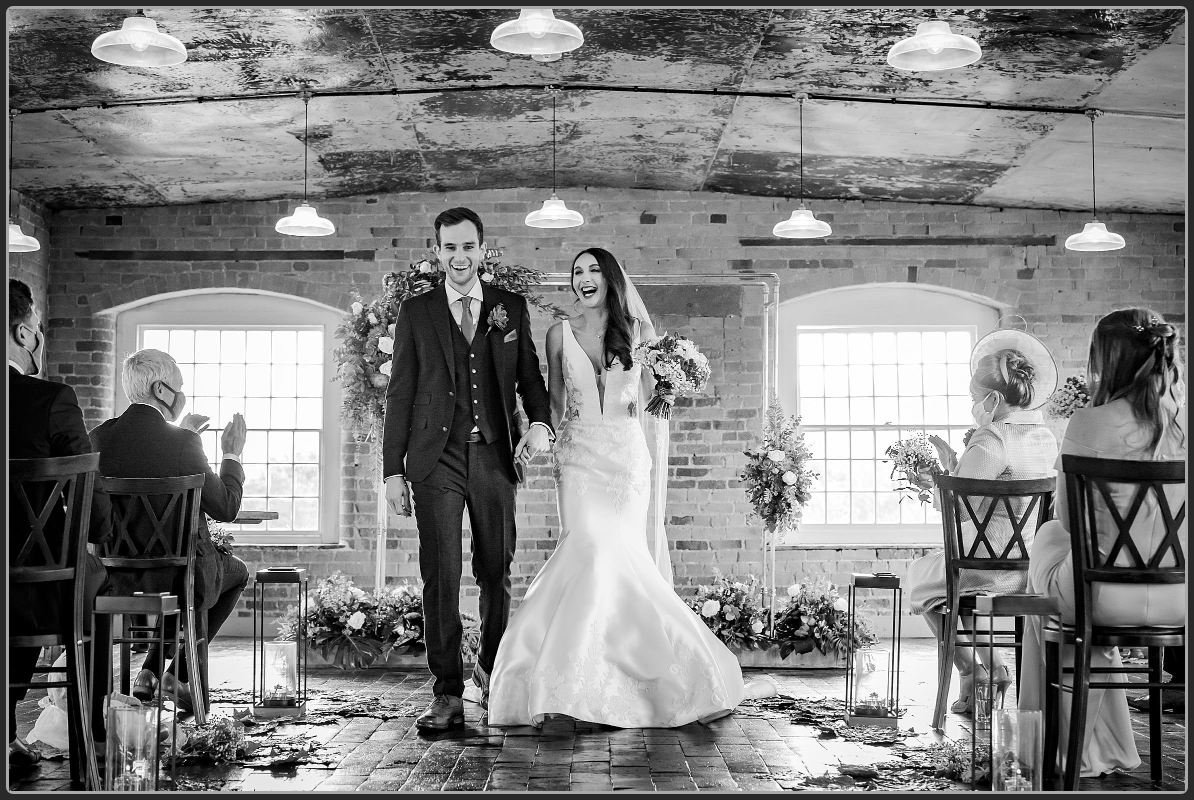 Bride and groom walking down the aisle