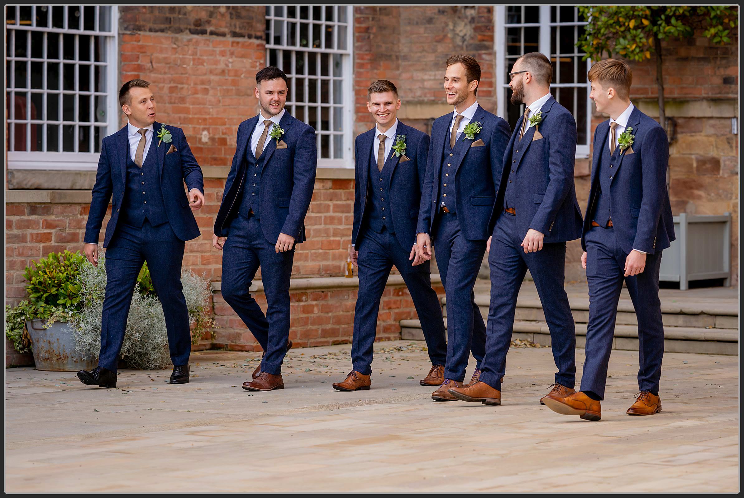 George and his groomsmen walking