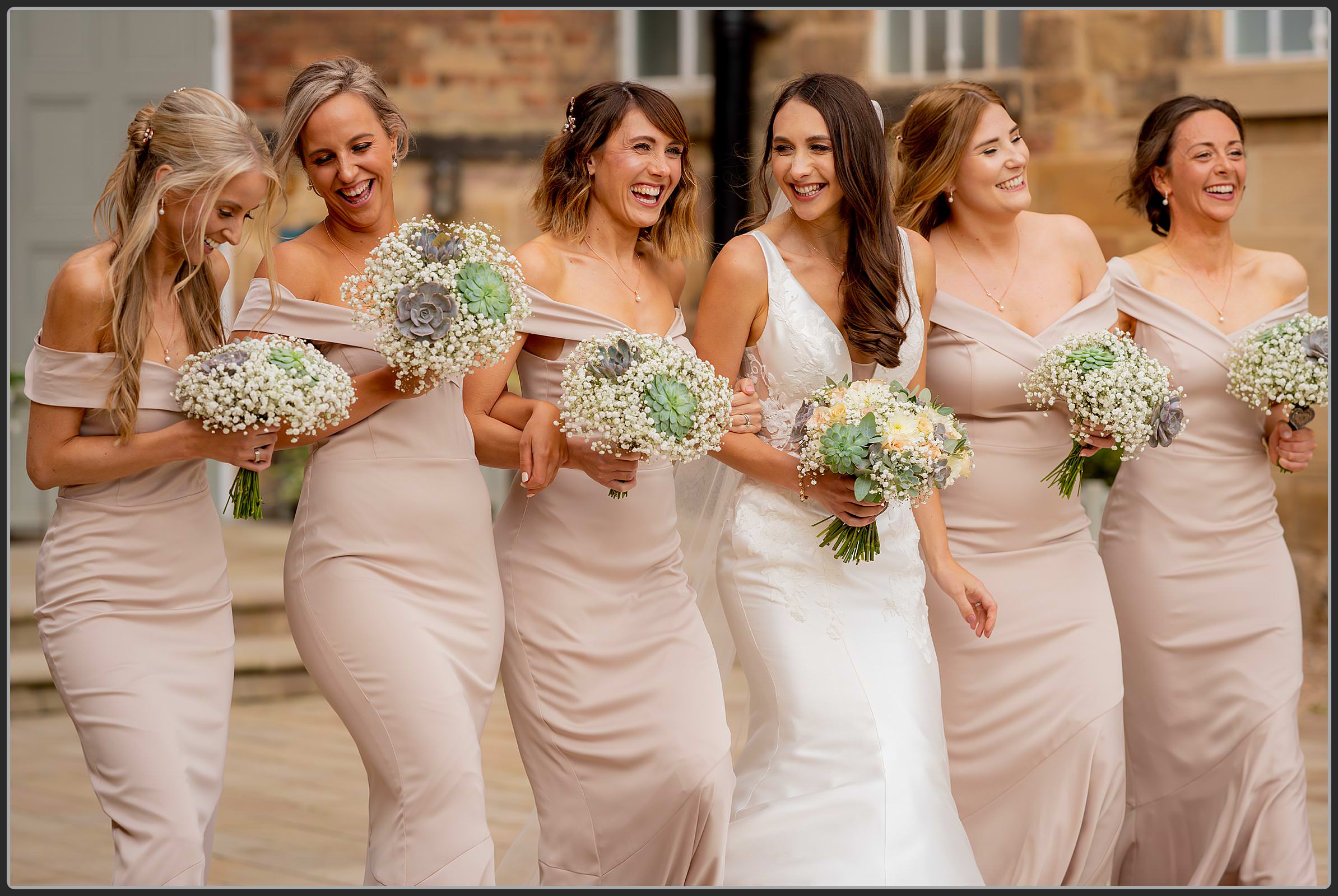 Ellie and her bridesmaids walking