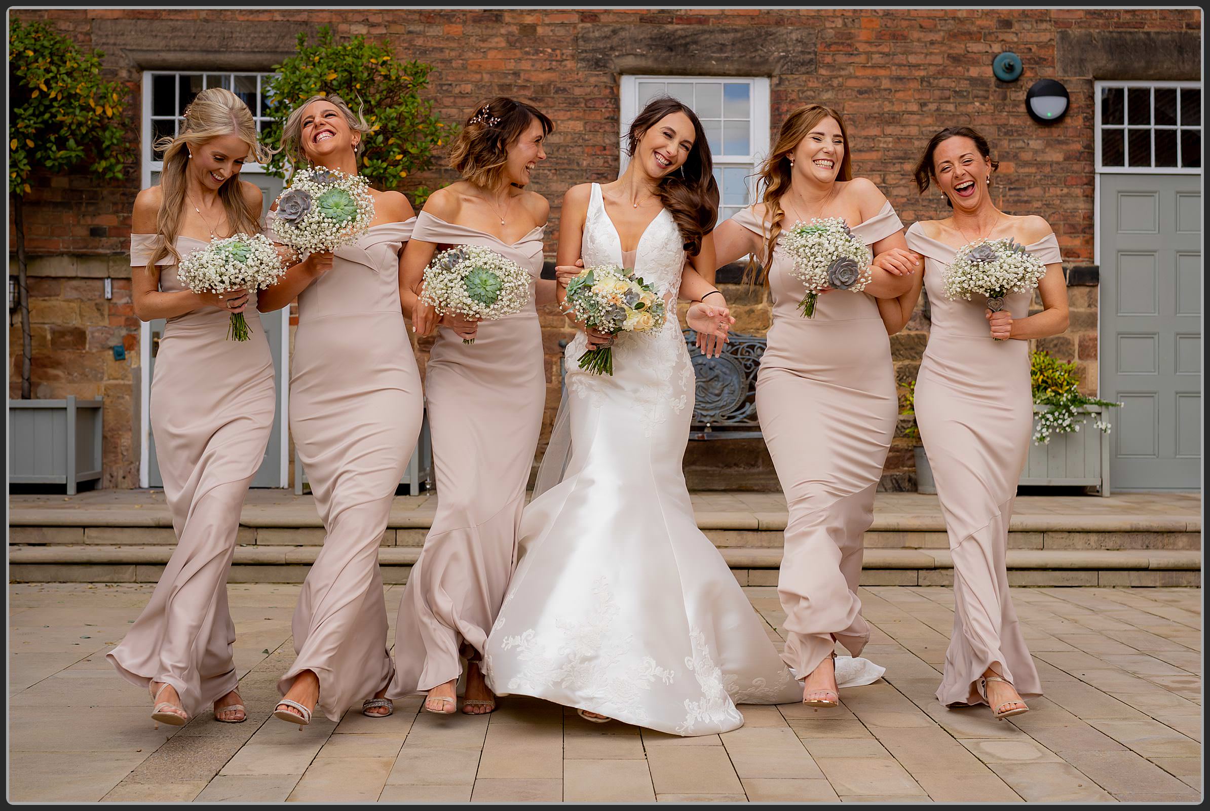 Ellie and her bridesmaids walking