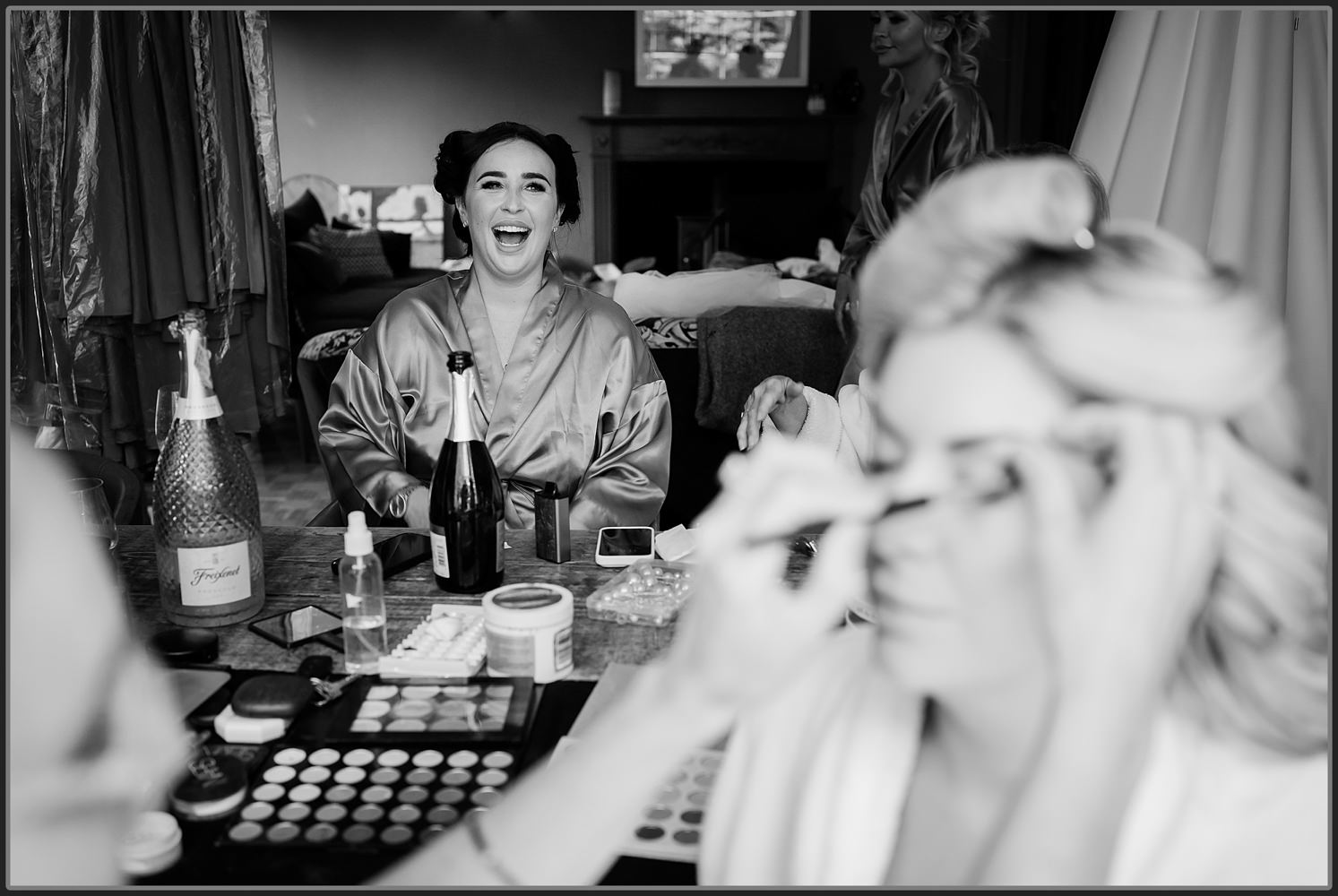 The girls laughing during the bridal preparations
