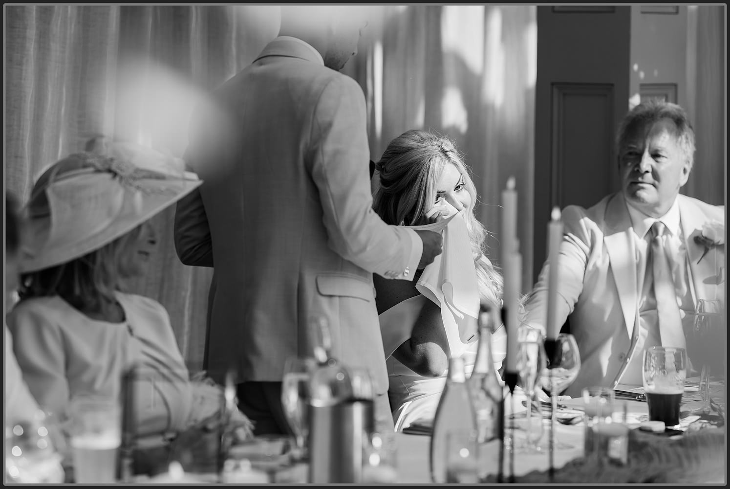 The bride emotional during the speeches