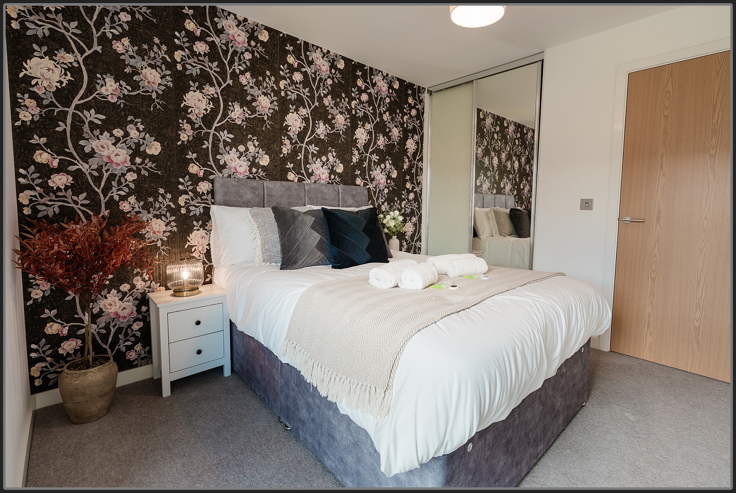 spacious Airbnb bedroom in West Midlands property with natural tones