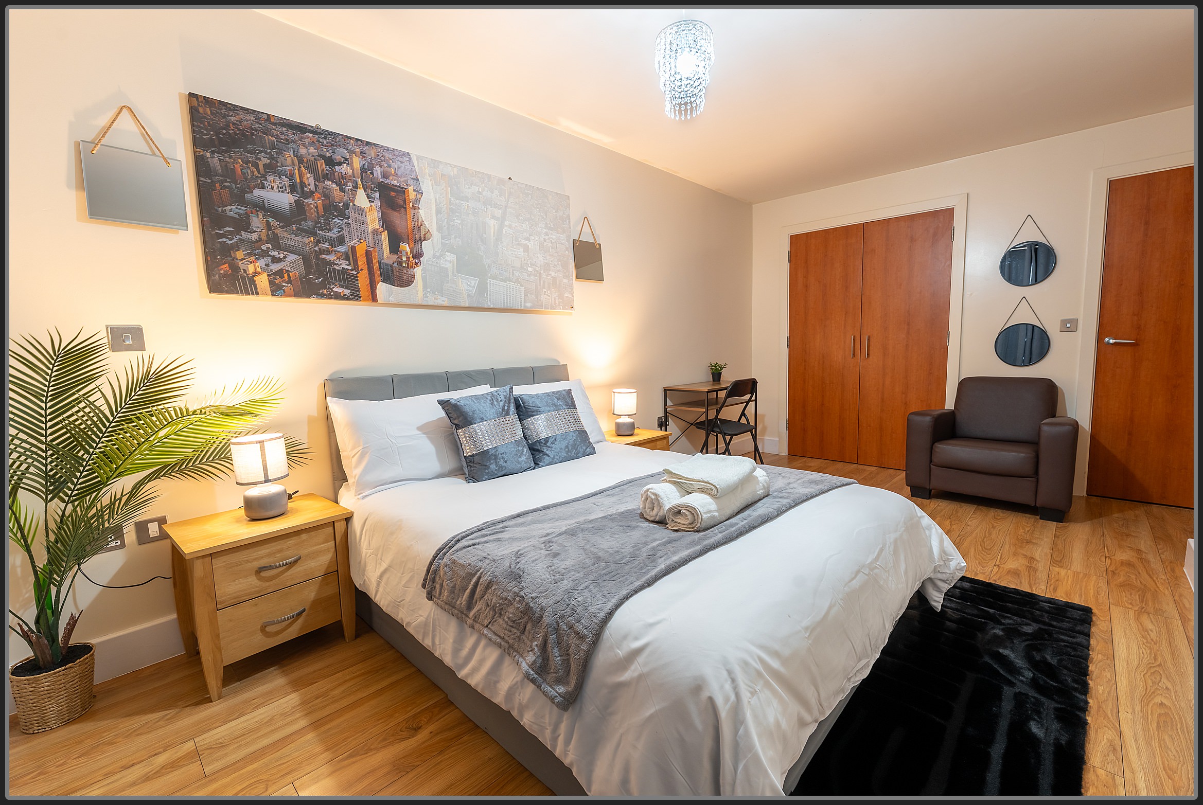 Minimal Airbnb bedroom in Birmingham with soft lighting and double bed